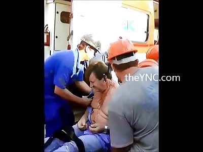 Look at this Mans Head as he is Put inside Ambulance...Its not Good At All for Him 