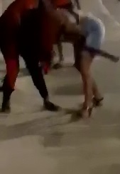 Girl in Street Fight gets Machete Blow to the Back and Keeps on Fighting 