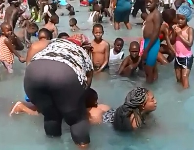 Young Boy at Public Swimming Pool Accidentally Removes the Bottom off a Ladies Bathing Suit 
