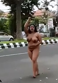 Jiggles as She Walks Naked down the Street 