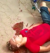 Young Thief in Bright Red lies Dying with his Bicycle 