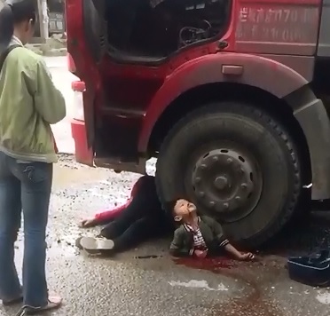 Short Shocking Video of Poor Boy Crushed under Truck 