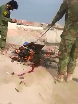 ISIS Members Burn on the Side of the Road 