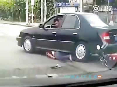 Motorcyclist is crushed by the driver of car that had crashed