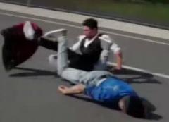 Guy drags his face on the asphalt