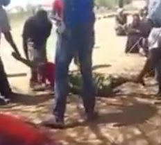 Woman is Beaten Mercilessly by Men in a Tanzania Village as villagers watch