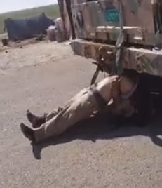 Tying Your Dead ISIS Enemy to your Humvee as and Ornament to Drag Around