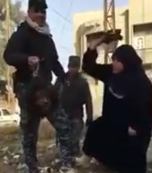 Elderly Woman Beats Daesh's Members Severed Head with Shoe