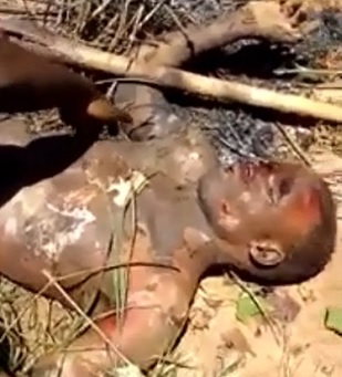 Curious People Touching and Joking with the Body of a Lynched Thief