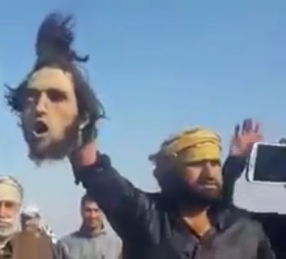 Happy Iraq Soldiers Dancing and Singing Holding Daesh's Severed head