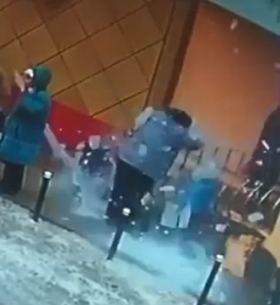 Large Piece of Ice Walls over Woman's Head Knocking Her Down 
