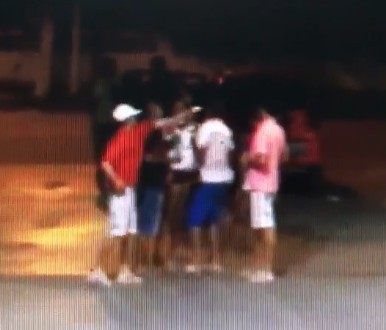 Man being killed with a point blank Head Shot at gas station (Watch the Red Shirt) 