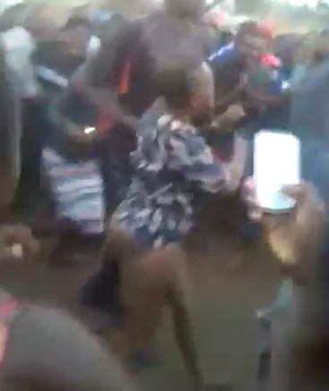 African Witch Stripped and Beaten by Crowd