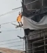Dude Burns On Top of a Building as People Watch