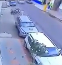 Dude Pinned and Crushed Between Two Cars... (w/CCTV)