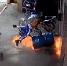 Barrel Explodes, Sending Guy Flying and Torching His Legs