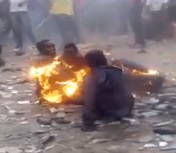 Guy Given a Beating and a Firebath