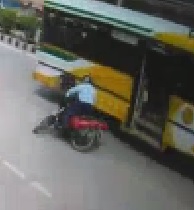 SQUISH: Motorcyclist Falls Under Bus 