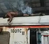 Man Sizzles on Top of Train
