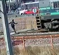 Oblivious Guy Doesn't Notice Train