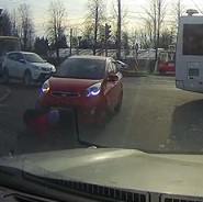 School Girl Trips in Front of Oblivious Driver Who Runs Her Over
