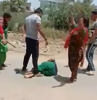 Woman Dragged from her Home and Beaten by Crowd