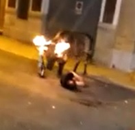 Bull With Its Horns on Fire Goes in on Poor Dude 