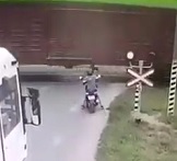 Kid Loses Control of Motorcycle Ends Up Under Train 