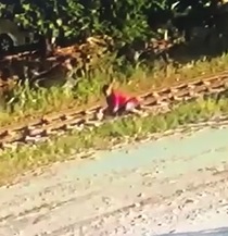 DAMN! Woman Faints on the Train Tracks....
