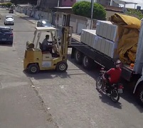 WTF: Moron Rides Right into a Fork Lift (Nearly Decapitated)..