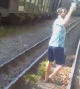 Moron Taking a Selfie on Tracks Doesn't Think of Oncoming Trains