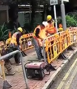 Worker on Fire Put Out by a Bucket of Fuel.