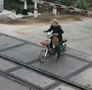 Impatient Girl on a Moped Isn't Fast Enough