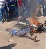 Two Thieves Lynched by Crowd and Burned.