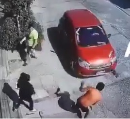 Idiot Argues with Wife Then Tries to Shoulder Block a Car.