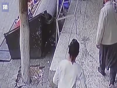 Child dramatically caught by passer-by after falling from balcony