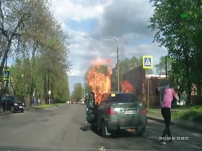 Girl in a Citroen catches fire while in motion. 