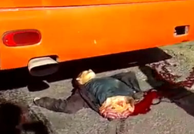 Motorcyclist crushed and mangled by a Bus