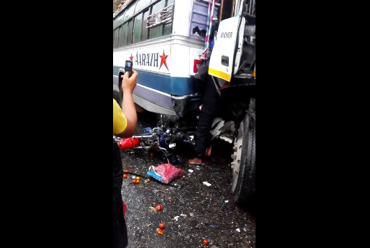 Motorcyclist And Death A Horrible Crushed Between A Bus And A Truck