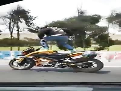 Motorcyclist suffers spectacular fall for acrobatics on public roads.