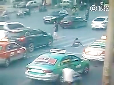 WTF VIDEO - DISABLED CRUSHED BY CAR CROSSING THE ROAD