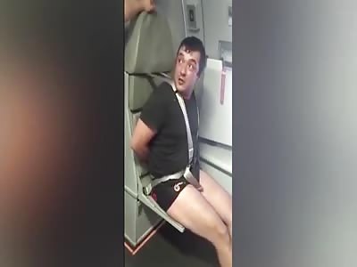 DRUNK AIR PASSENGER BOUND TO SEAT AFTER PUNCHING FLIGHT ATTENDANT IN FACE