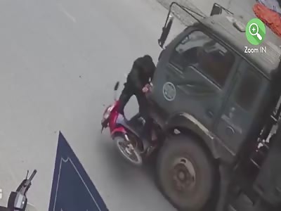 MOTORCYCLIST BEING HIT BY TRUCK