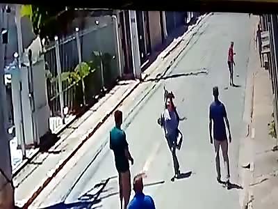 WOMAN BEING STABBED IN THE MIDDLE OF STREET
