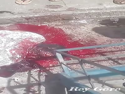 DEAD MAN LYING IN A PUDDLE OF BLOOD