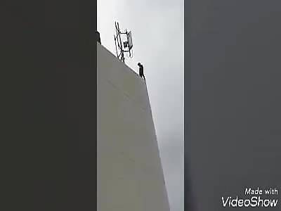 MAN JUMPING TO HIS DEATH FROM BUILDING