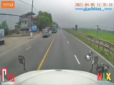 BIKER ESCAPES FROM A TRUCK AND IS HIT BY ANOTHER