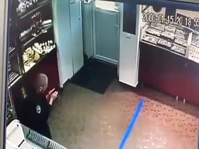 SHOP SECURITY IN RUSSIA IS BEATEN BY ROBBERS