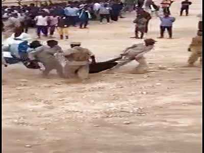 WOMEN BEING DRAGGED AND BEATEN BY SOLDIERS
