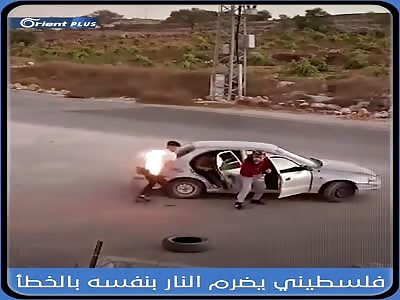 PALESTINIAN THROWS A MOLOTOV COCKTAIL AT AN ISRAELI SETTLEMENT